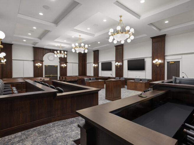 Classic chandelier and sconce lighting installed in a courtroom at Carmel Police Department
