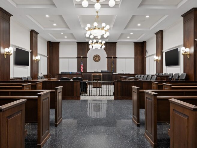 Classic chandelier and sconce lighting installed in a courtroom at Carmel Police Department